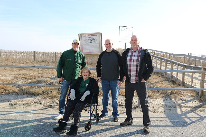 Mary Stearne, a longtime supporter of the beach patrol, is joined at the ceremony by her sons, from left, Dave, John and Bill.