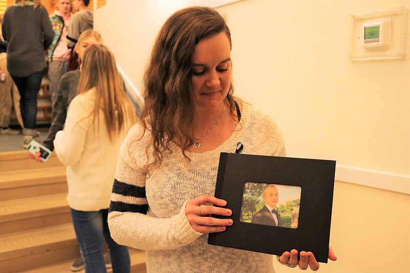 Brandy Armpriester displays a photo of her brother, Nolan Siciensky, who died in 2015. 