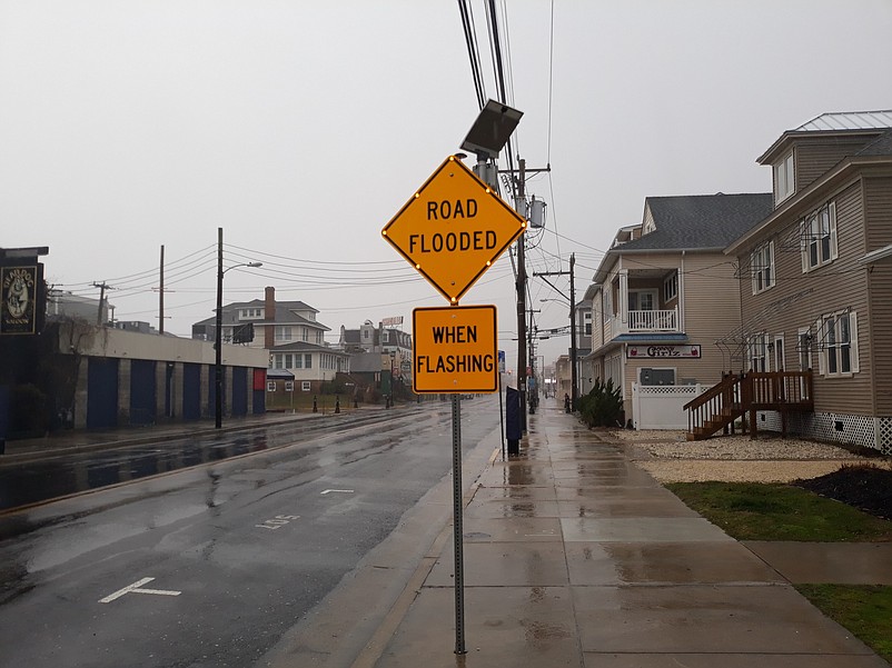 Flashing signs throughout Sea Isle warn motorists when floodwater is on the streets.