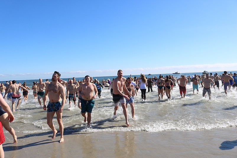 Brave "polar bears" emerge from the chilly surf during the 2020 plunge, the last year the official event was held.