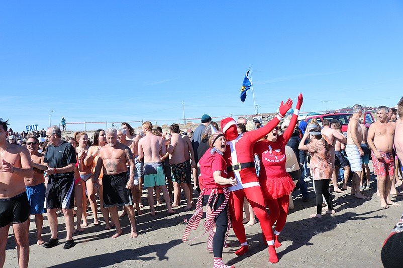 Outrageous costumes are often worn by the plungers as part of the madcap celebration.