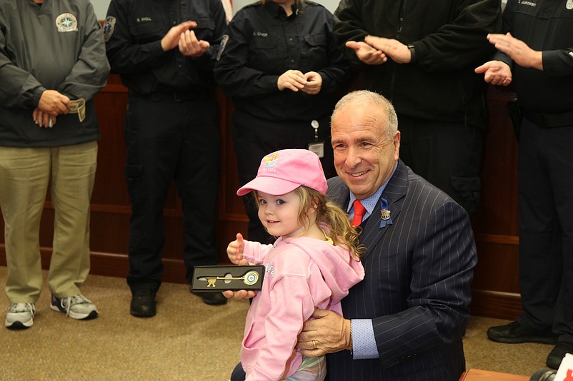 Mayor Leonard Desiderio hands Briella Golato a ceremonial key to the city.