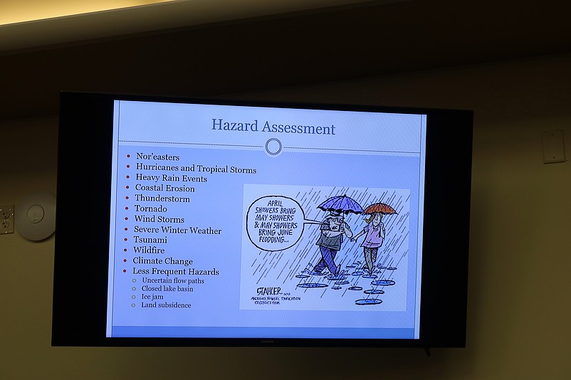 A cartoon in the report uses humor to warn of flooding.