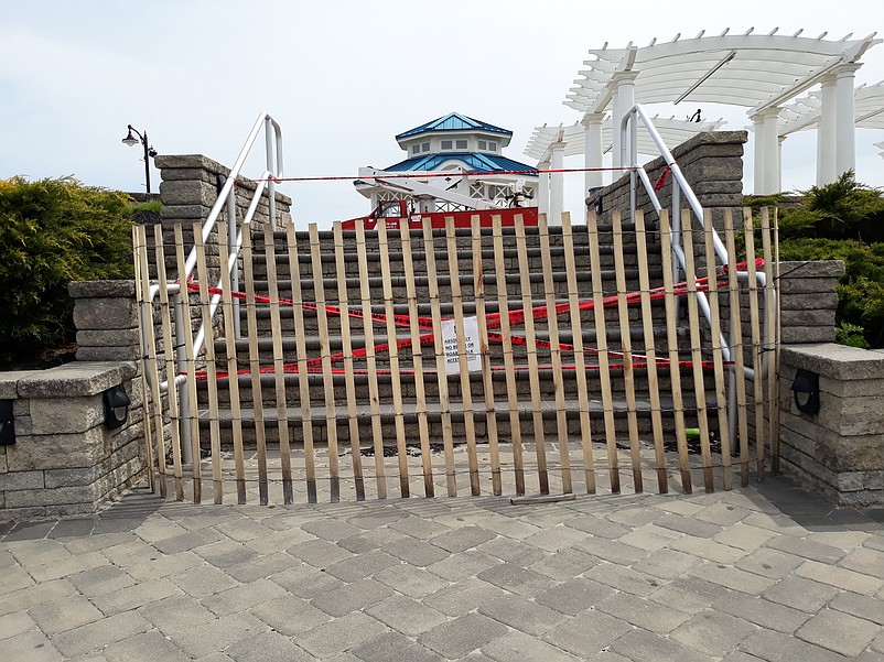 A barricade blocks access to steps leading to the Promenade at the beach block of John F. Kennedy Boulevard.