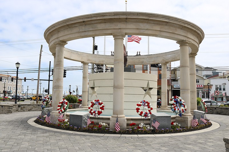 Red, white and blue wreaths honoring the nation's war dead decorate the monument at Veterans Park.