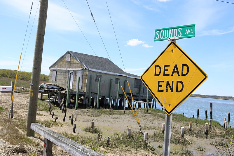 The tiny house sits on a dirt road at the end of Sounds Avenue.