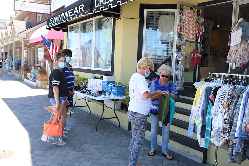 Merchants will move their inventory outside their shops for a sidewalk sale.