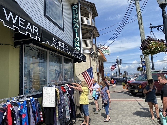 Merchants will move their inventory outside for a sidewalk sale.