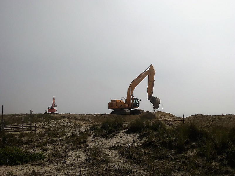 Repairing the dunes is a part of the overall beach replenishment project. 