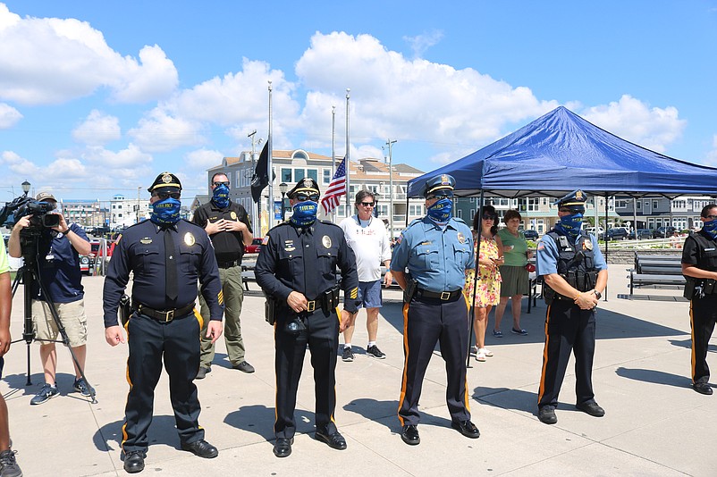 Police officers wear face coverings during the HERO Campaign ceremony to help prevent the spread of the coronavirus.