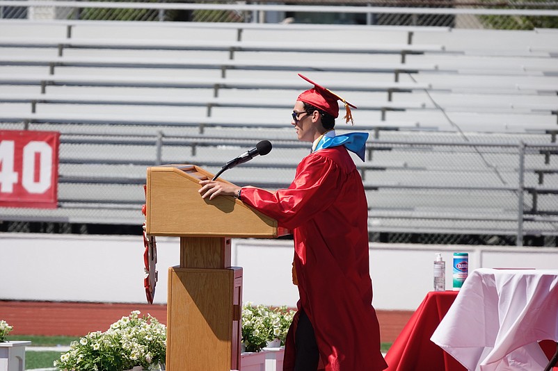 Graduate Joshua Barnes gives a farewell speech.