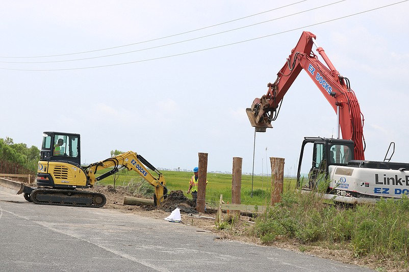 EZ Docks uses heavy construction equipment to begin building the new bayfront attraction.