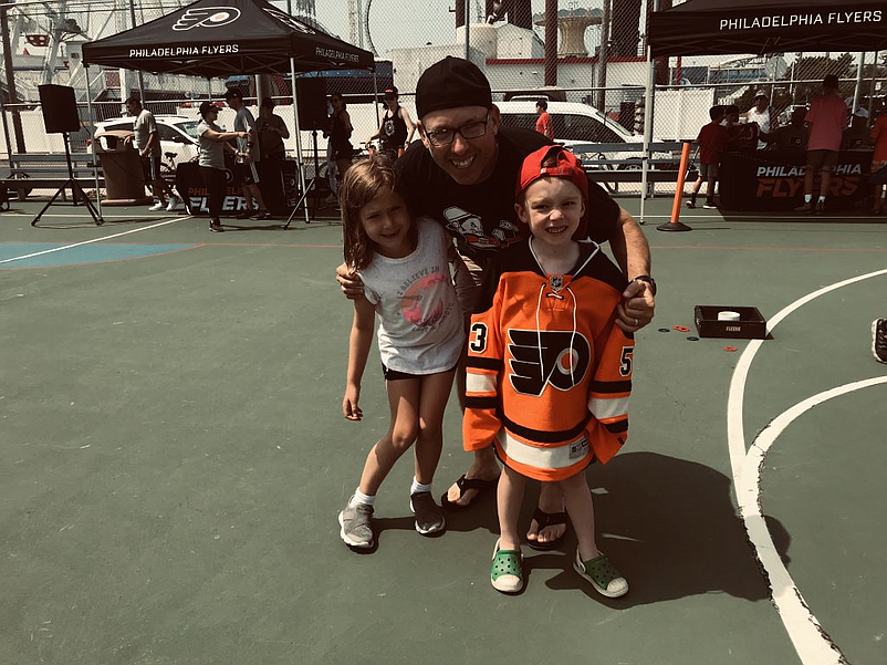 Flyers community outreach events are always family affairs, such as a recent Community Caravan attended by dad John Grant and kids Riley (left) and Breandan, all from Fallston, Md.,