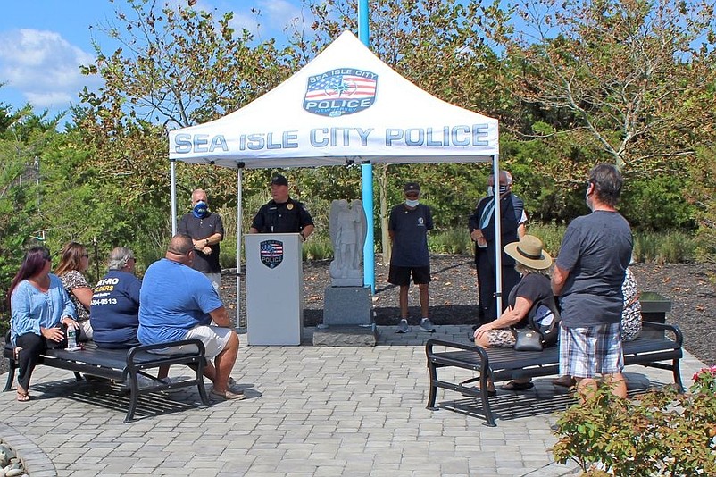 Sea Isle City Police Chief Tom McQuillen, standing at podium, speaks during the ceremony. (Photo courtesy of Sea Isle City Police Department Facebook page)