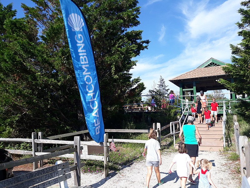 A big, blue "Beachcombing" sign marks the way to the start of the tour.