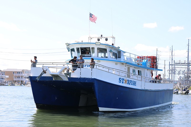 A charter boat plies the lagoon next to the Sea Isle City Municipal Marina.