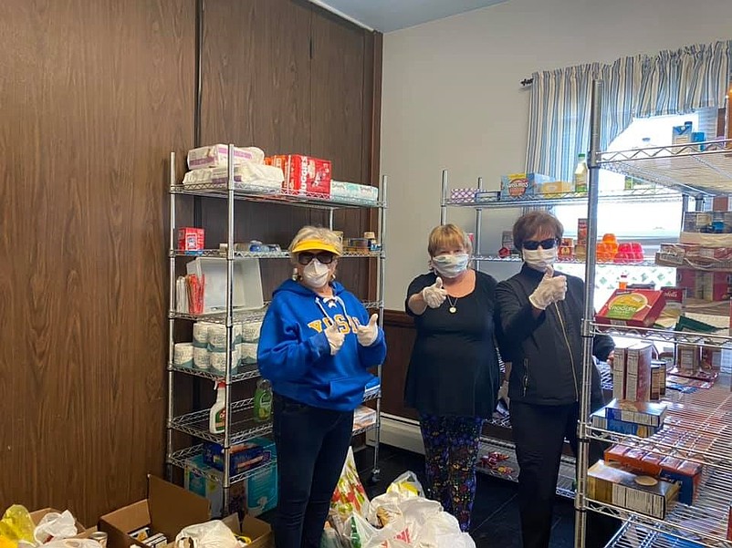 Mahjong club members Peg Schwind, Wendy Dougherty and Barbara Doring bring donations to the United Methodist Church food bank. (Courtesy United Methodist Church Facebook page)