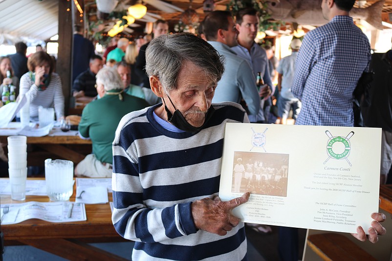 Former lifeguard Carmen Conti, now 92, points to himself in a Sea Isle City Beach Patrol photo from 1945.