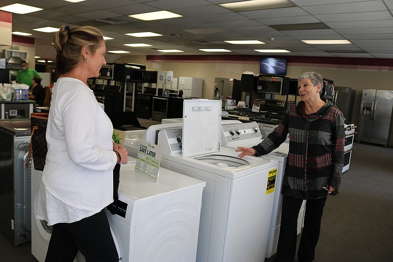 Customer Nancy Friday, left, an Ocean City resident, speaks with Johnson Appliances saleswoman Linda Sacco while both observe social distancing. 