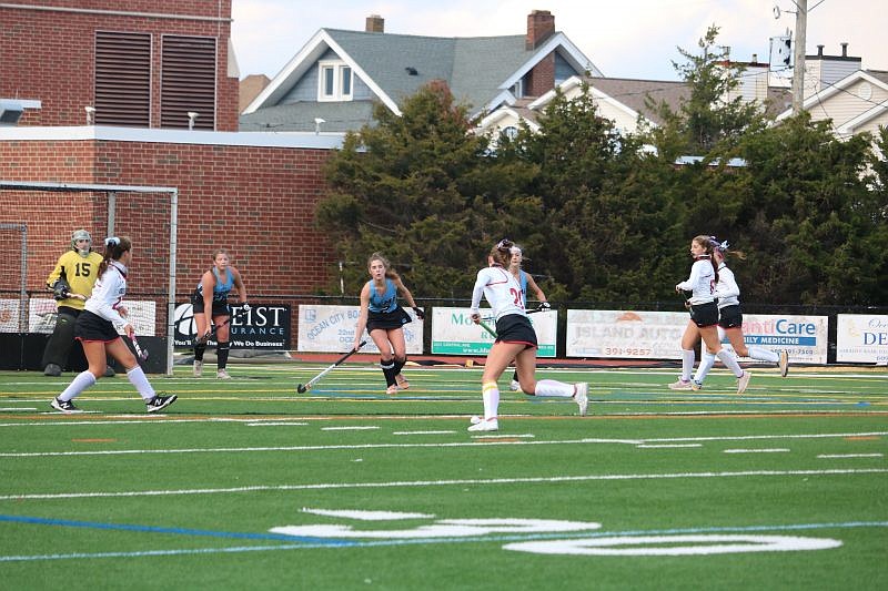 Tara McNally (20) eyes up the cage for one of her hat trick goals on the afternoon.