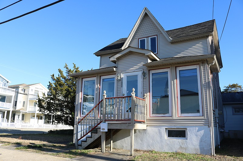 The old house at 8505 Landis Ave. will be demolished and replaced with a new three-story commercial project, according to plans.