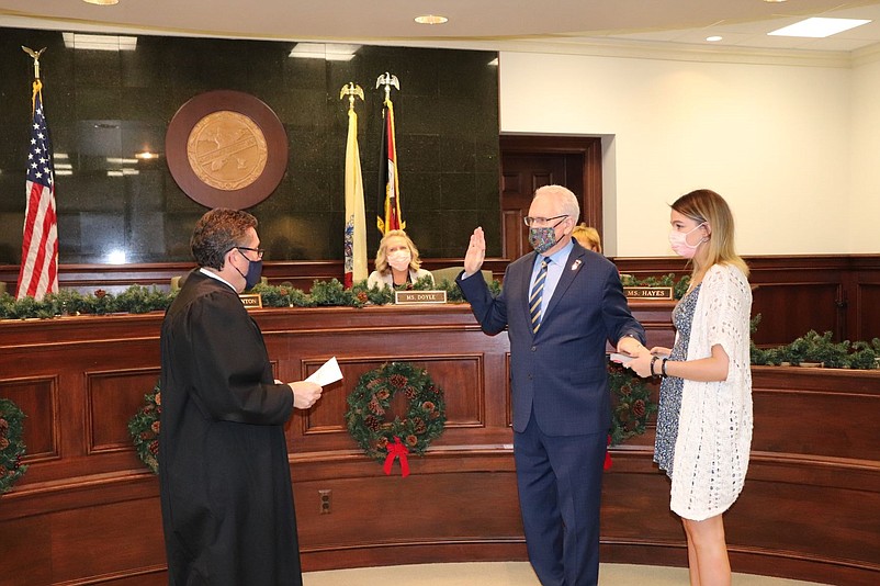 Commissioner Jeffrey L. Pierson is sworn in to another term by Surrogate Dean Marcolongo during a ceremony Wednesday. (Photos courtesy of Cape May County)