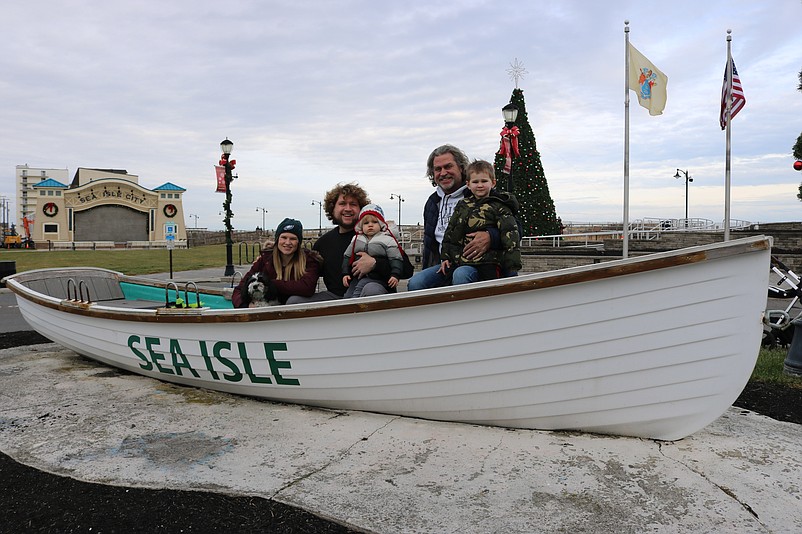 Members of the Fecher family gather together in a Sea Isle City lifeguard boat in the center of town during their New Year's Eve celebration.