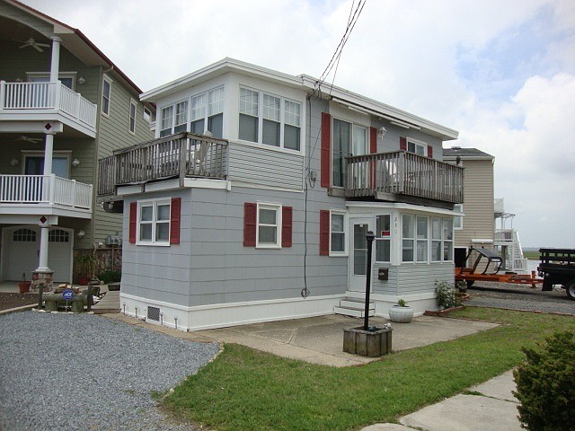 The bayfront duplex at 230 82nd Street will be replaced by a new single-family home. (Photo courtesy of McCann Realtors)