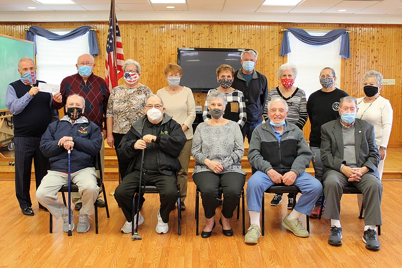 Mayor Leonard Desiderio, standing far left, presents a $3,000 check to board members of AARP Chapter 710.