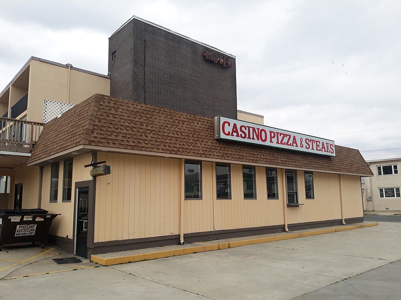 Casino Pizza &amp; Steaks and the Coast Motel in the background are part of the LaCosta Lounge complex .