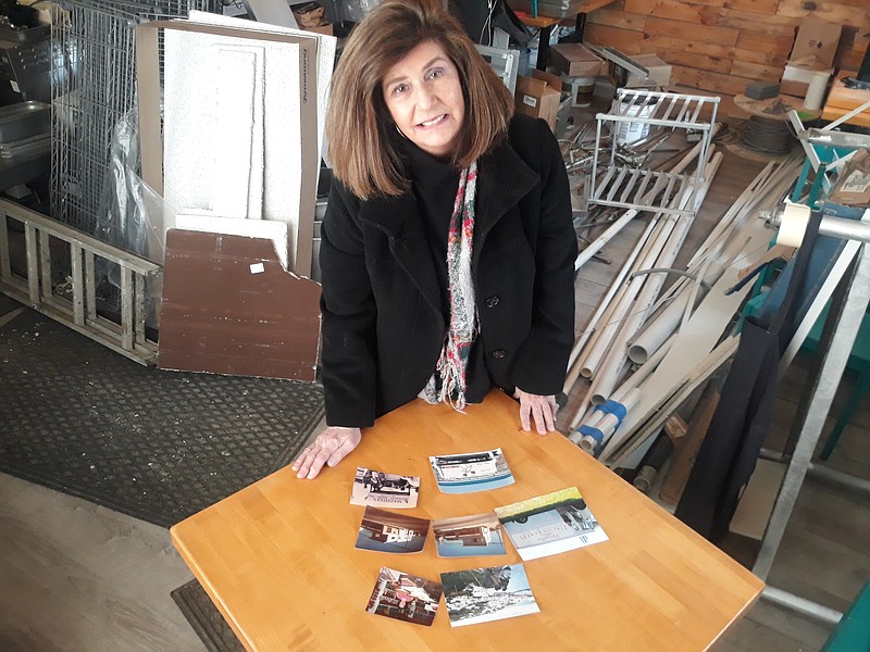 Mary Jane Gleeson, a sales agent for Berkshire Hathaway HomeServices Fox &amp; Roach Realtors, looks at old photos of the former Mazzella's Bakery owned by her late parents.