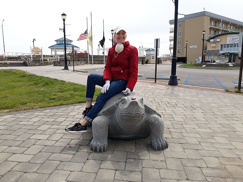 SeaIsleNews.com reporter Maddy Vitale sits on the Sara the Turtle statue in Excursion Park that showcases Sea Isle City's terrapin mascot.