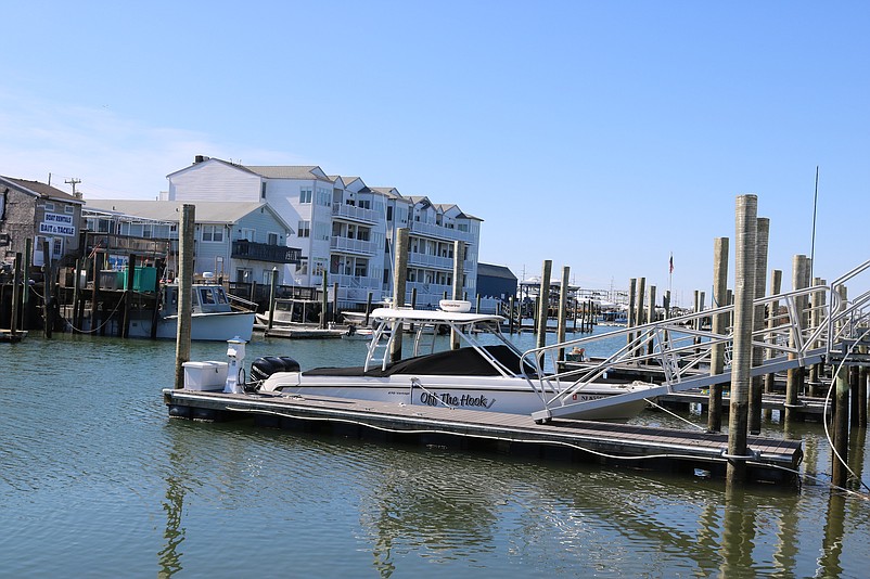 A lone boat moored at Sea Isle's municipal marina reflects the quietness of the off-season.