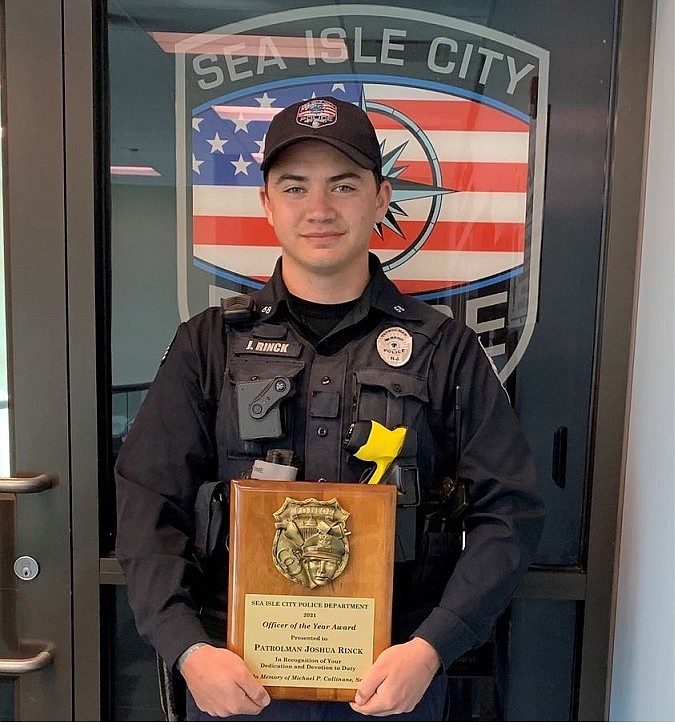 Josh Rinck holds his award. (Courtesy of Sea Isle City Police Department Facebook page)