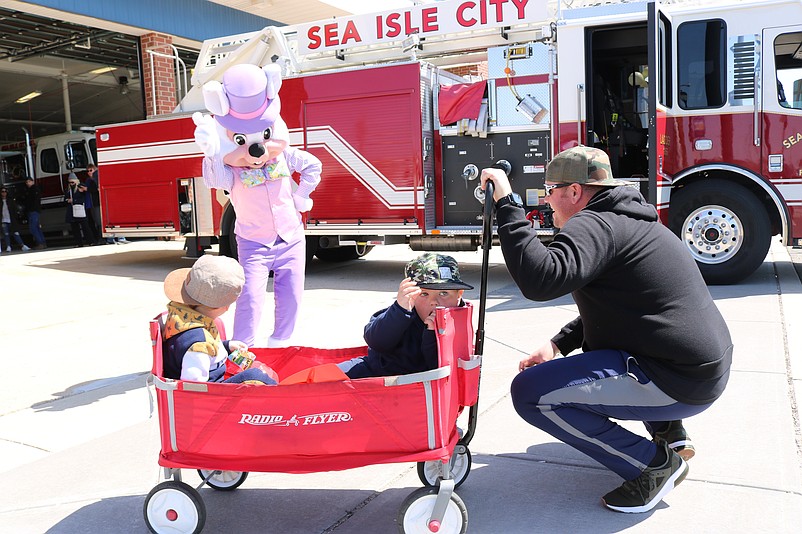 The Easter Bunny pays a visit to 3-year-old twin brothers Patrick and Jackson Ready and their father, Tom Ready, a Sea Isle police sergeant.