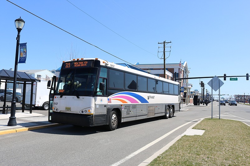 A New Jersey Transit bus waits to pick up passengers at the stop next to City Hall.