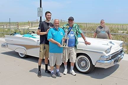 Sea Isle City Mayor Leonard Desiderio (front, center) is shown presenting the “Mayor’s Choice” trophy to Bob McArdle, of Ridley Park, Pa., owner of this 1958 Ford Fairlane convertible. The mayor's nephew, Robert Desiderio (at left) and Auto Show Host Jim Ambro (at right) look on during the awards ceremony.