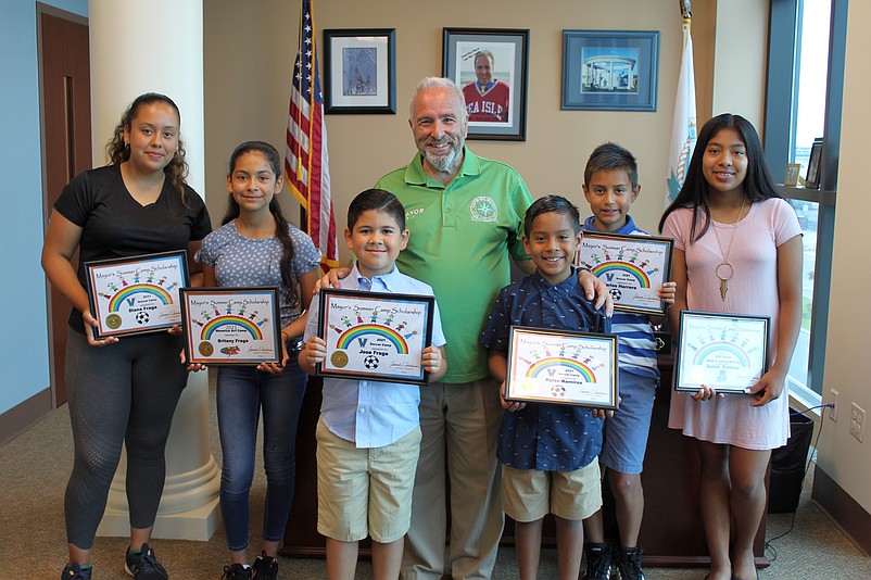 Mayor Leonard Desiderio is joined by “Summer Camp Scholarship” recipients, from left, Diana Fraga, Britany Fraga, Jose Fraga, Dylan Ramirez, Carlos Herrera, and Danna Ramirez.  Missing from photo is Clare Capone. 