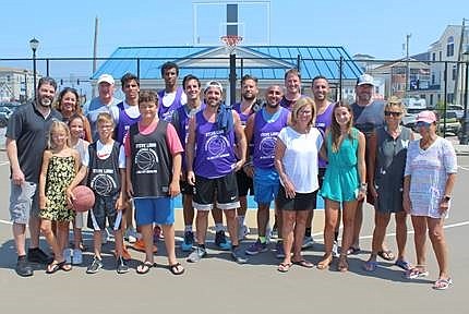 Members of the Libro family join with players from the winning team for a group photo after the tournament. (Courtesy of Sea Isle City)