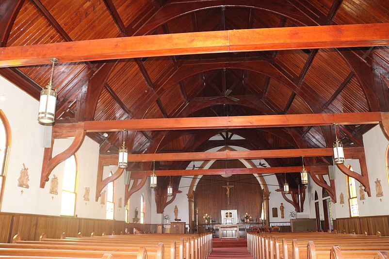 Massive exposed beams and the church's arched ceiling resemble the bottom of a ship.