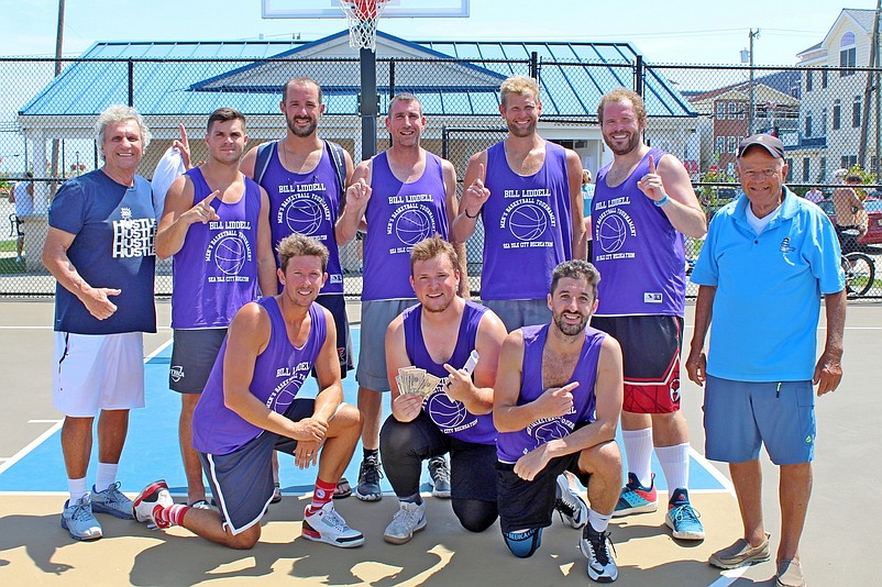 Members of the "Liddell's Legion" winning basketball team are joined by Bill Liddell, left, and Sea Isle City Councilman Jack Gibson, right.