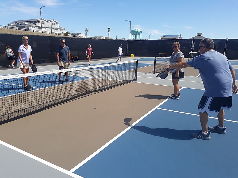 Bob Moran and his wife, Michele, on right, play a game of pickleball with Moran’s sister, Christine, and her husband, Anthony Sanguinetti.