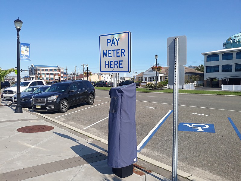 A parking kiosk on John F. Kennedy Boulevard remains covered until next May.