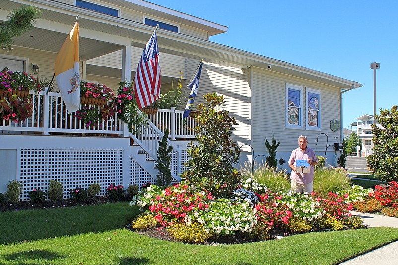 Father Perry Cherubini, pastor of St. Joseph Catholic Church, shows off the beautification award for the church campus in 2021. (Photos courtesy of Sea Isle City)