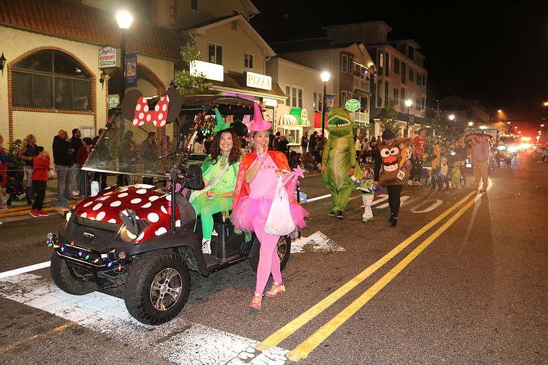 A colorful procession of characters marches down Landis Avenue.