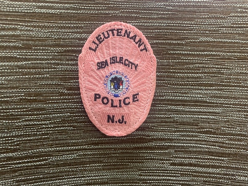 A closeup of the pink badge that all 22 Sea Isle police officers are wearing.