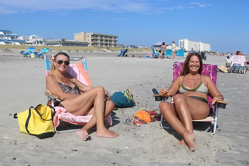 Toni Hilsin, left, and her friend, Doreen Callahan, relax on the 43rd Street beach.