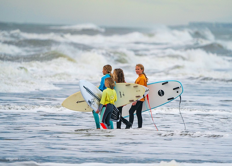 Some of the competitors wait their turn to hit the waves.