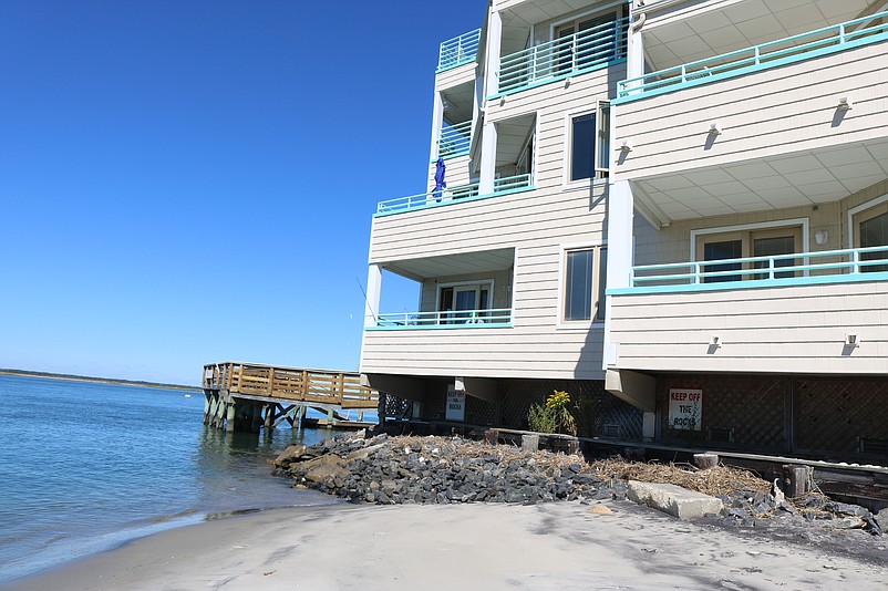 Townsend Shoals, a 24-unit condominium built in 1992, is perched directly over the water and beach on the bay side of Townsends Inlet.