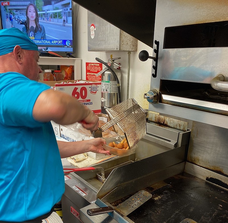 Larry Gremo works the grill at the Commodore Club, where he is the head chef. (Photos courtesy of Larry Gremo)